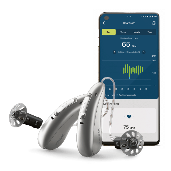 The Phonak Audéo Fit in front of a phone showing the health monitor app associated with the hearing aid. 